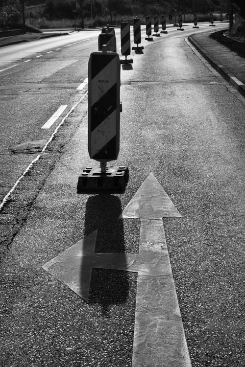 Road direction markings and traffic control barriers