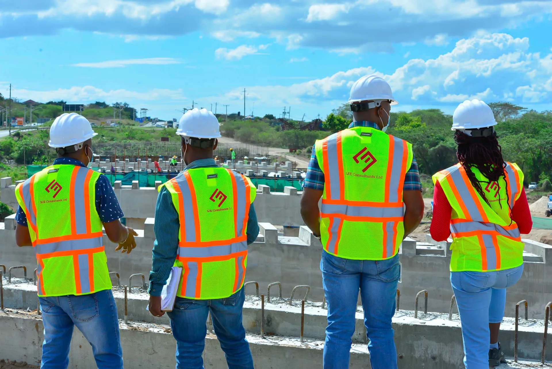 SJE professionals overlooking an active project site